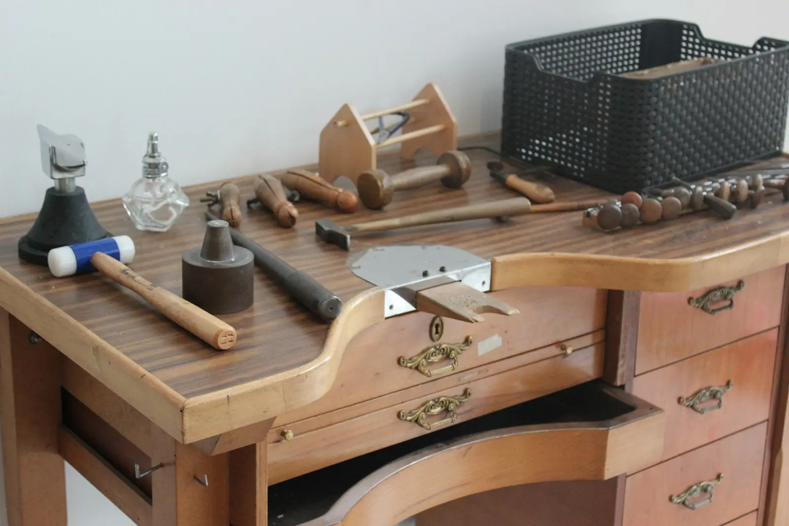 Traditional jeweler's bench with hand tools laid out for work